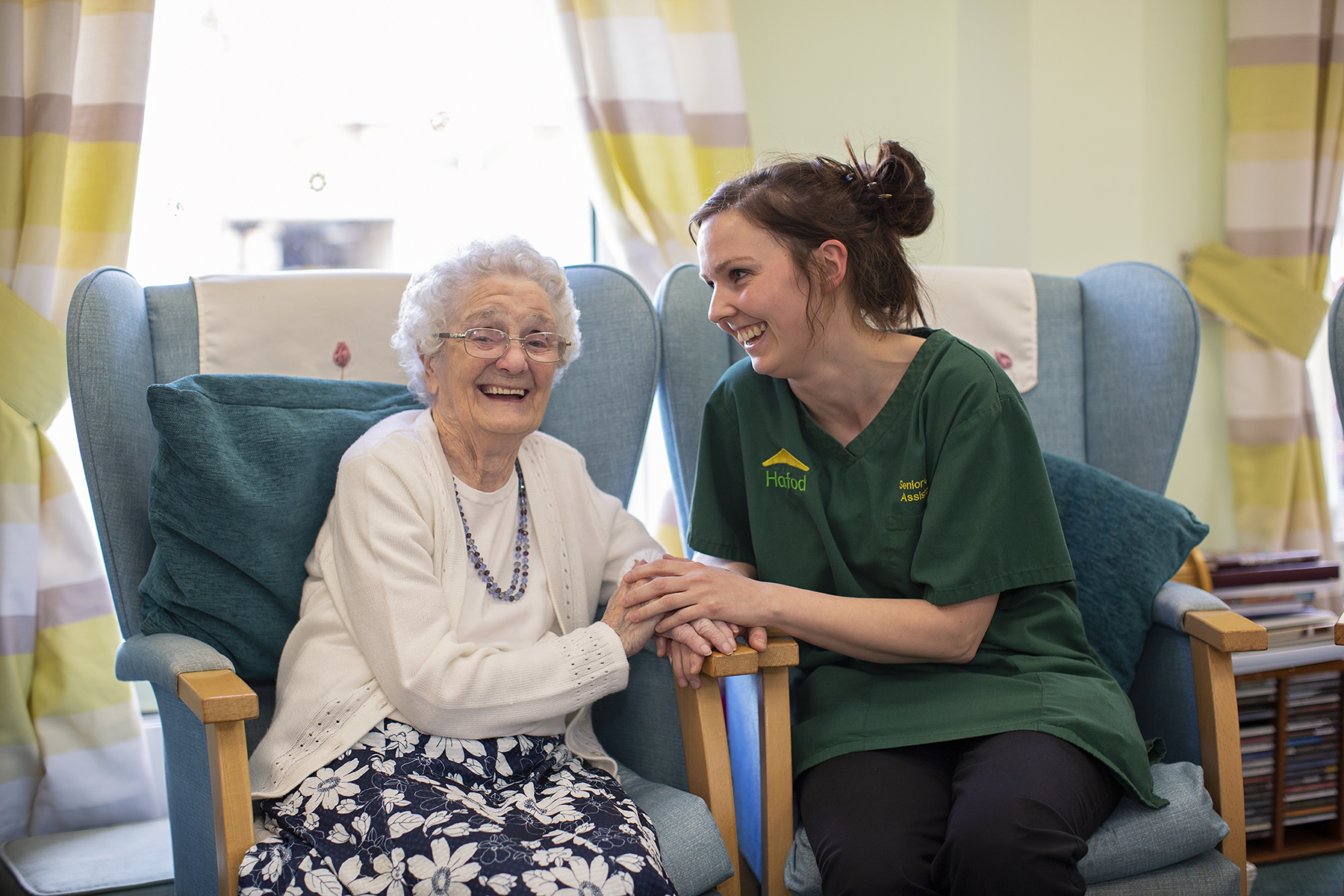 Carer and resident chatting at Arthur Jenkins Care Home