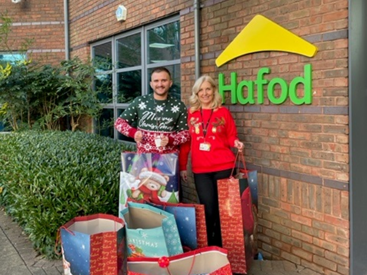 Colleagues outside Hafod head office with Christmas gifts to give out to customers