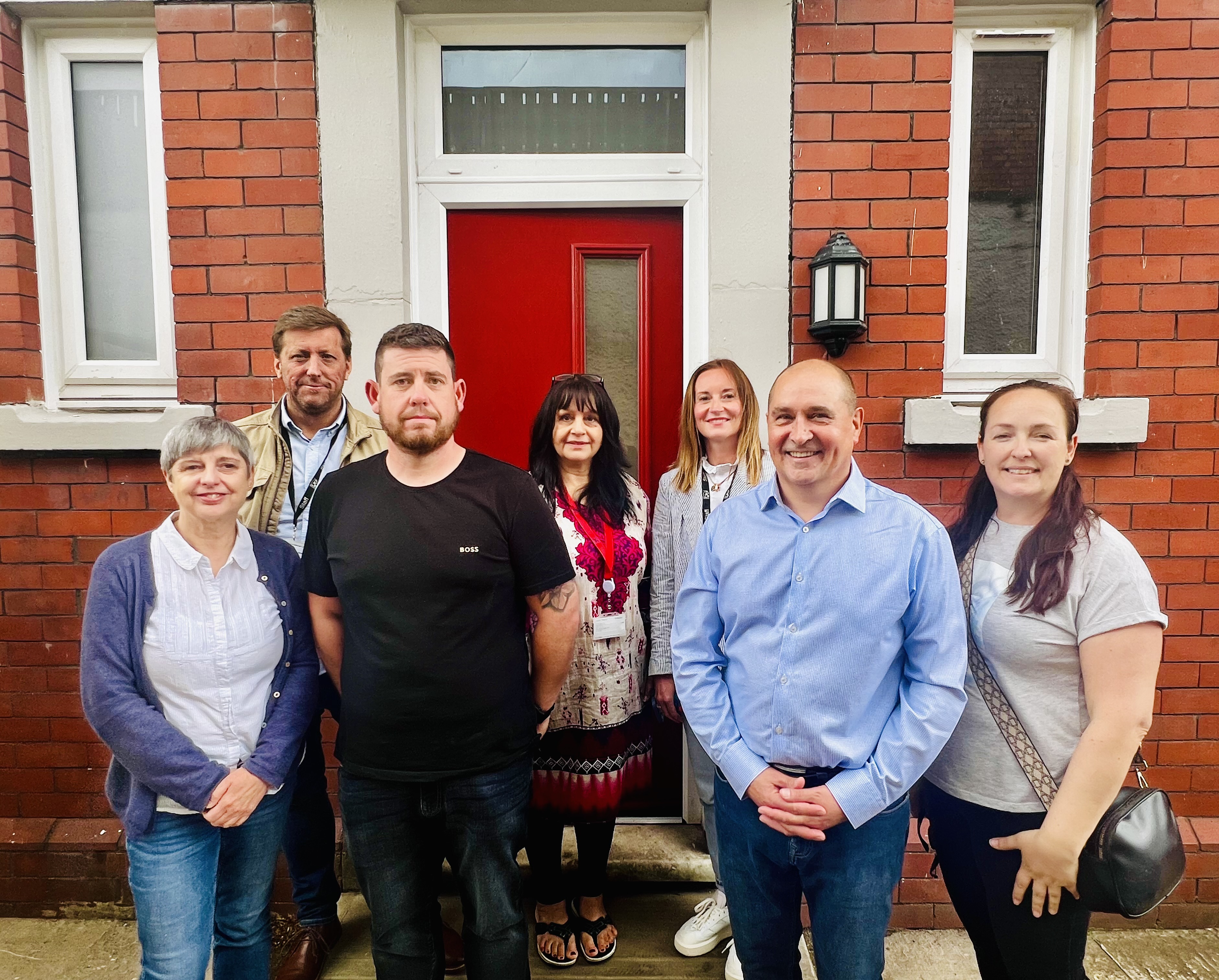 People in front of a house