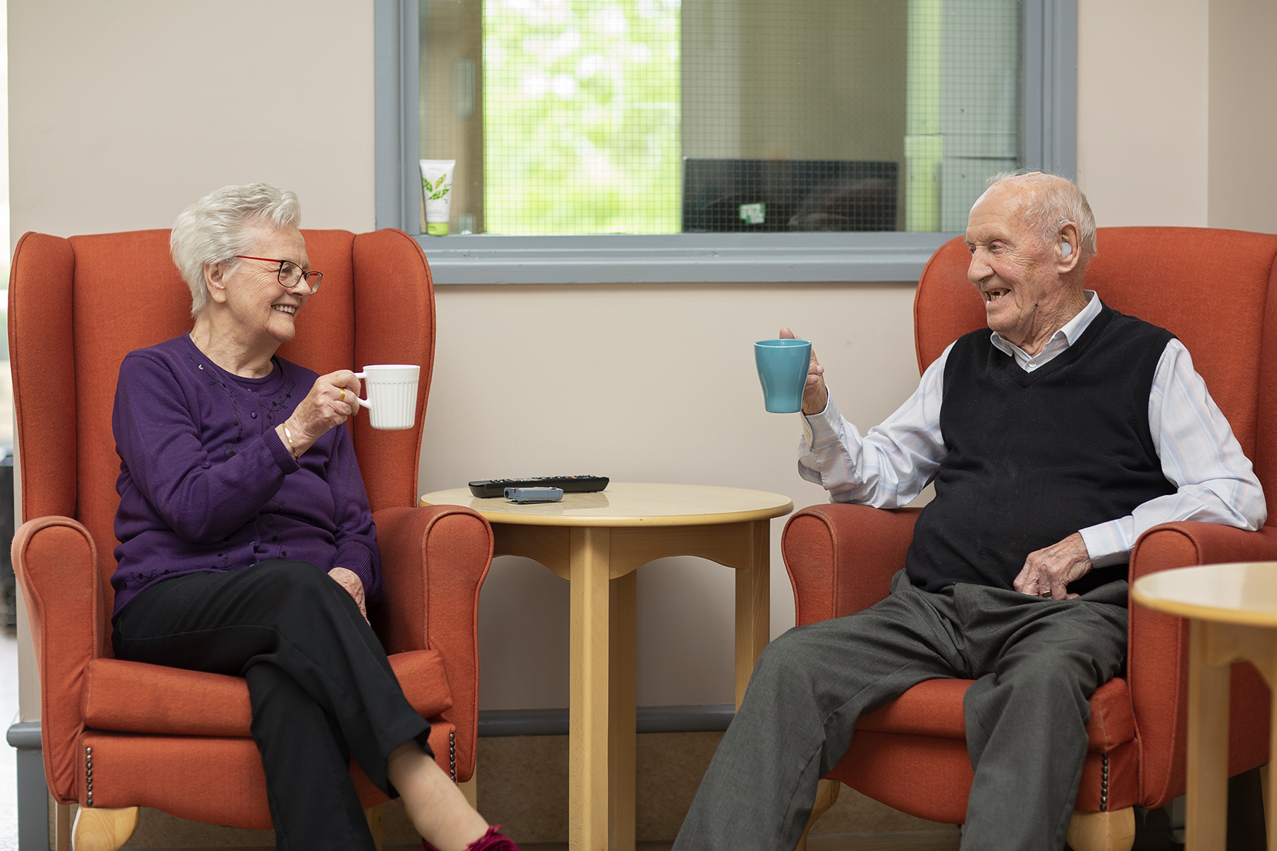 Residents having a cup of tea together at Cwmbran House Care Home