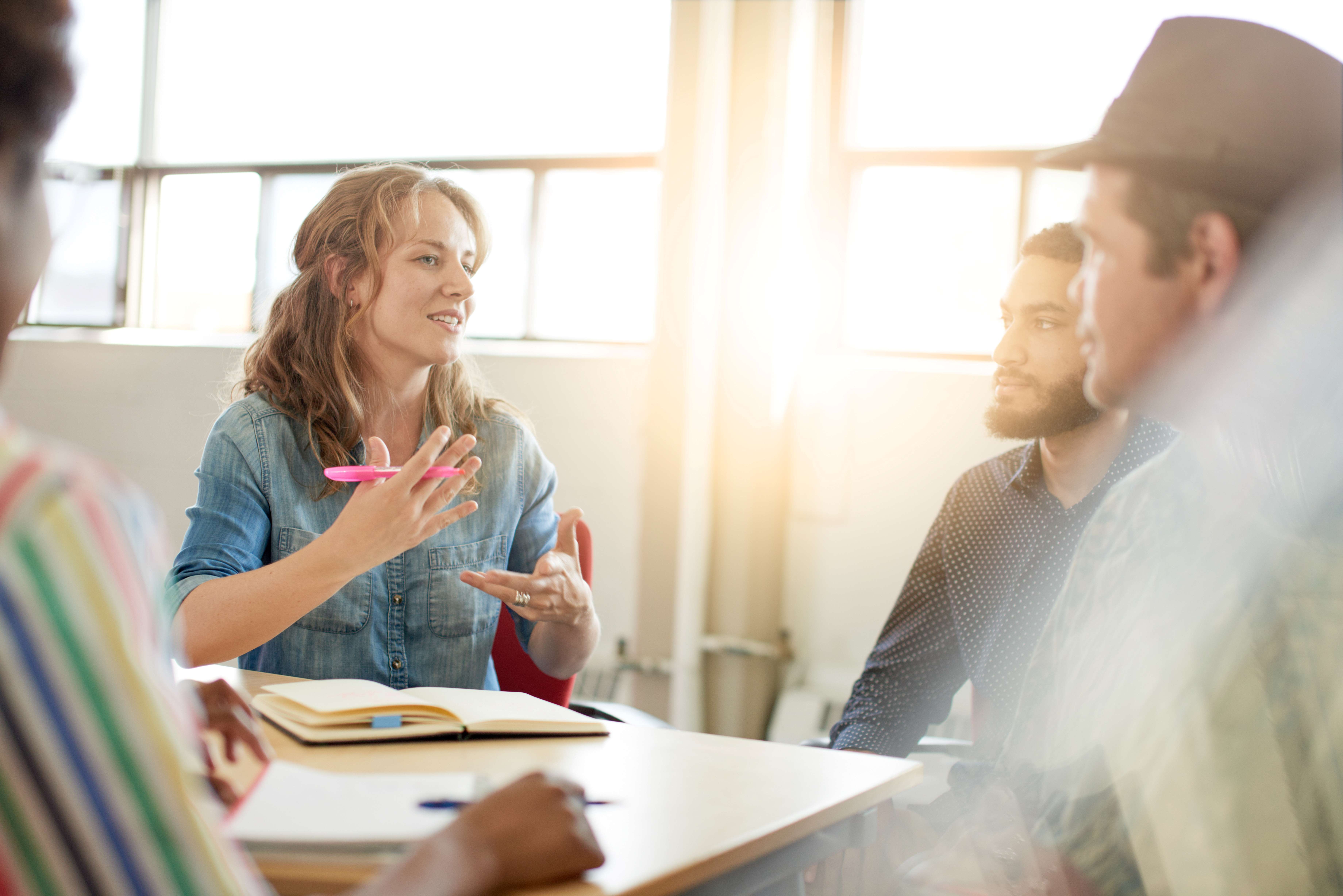 Group chatting together in a meeting