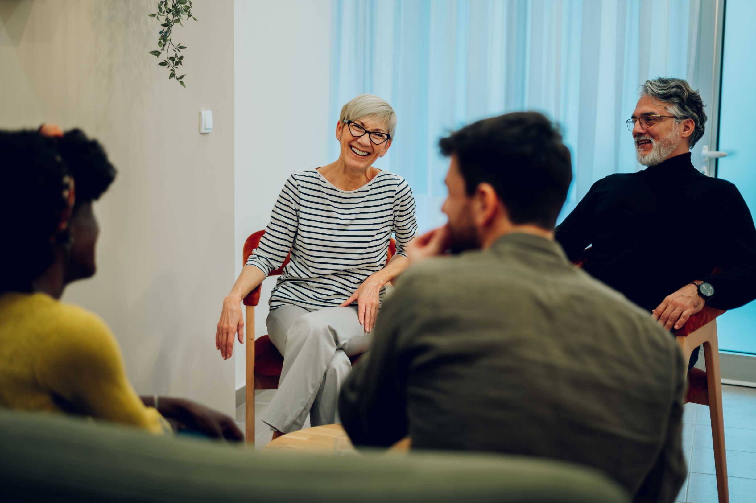 Group of people in a meeting together chatting