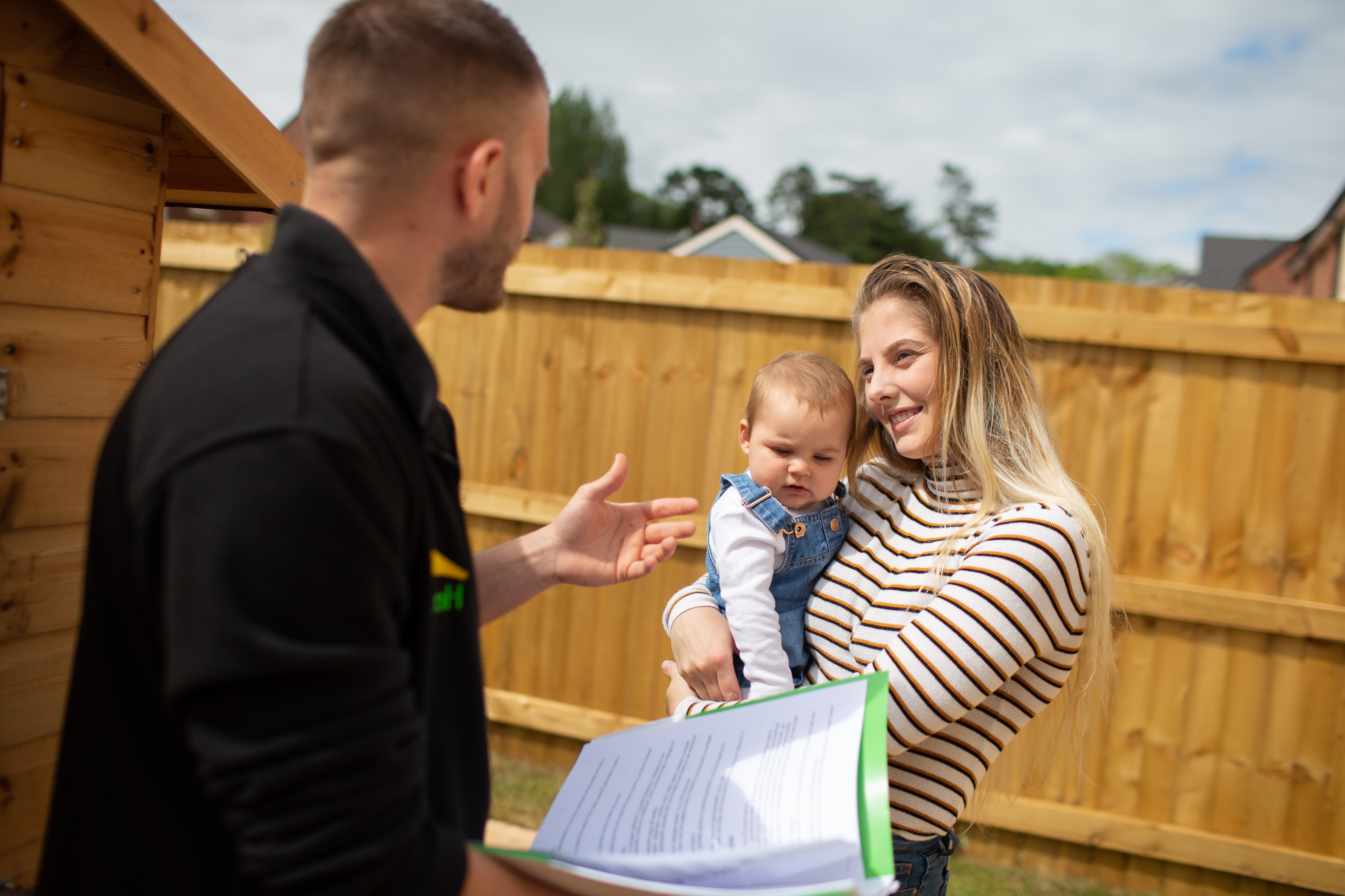 Contract holder chatting with their neighbourhood coach in their new garden