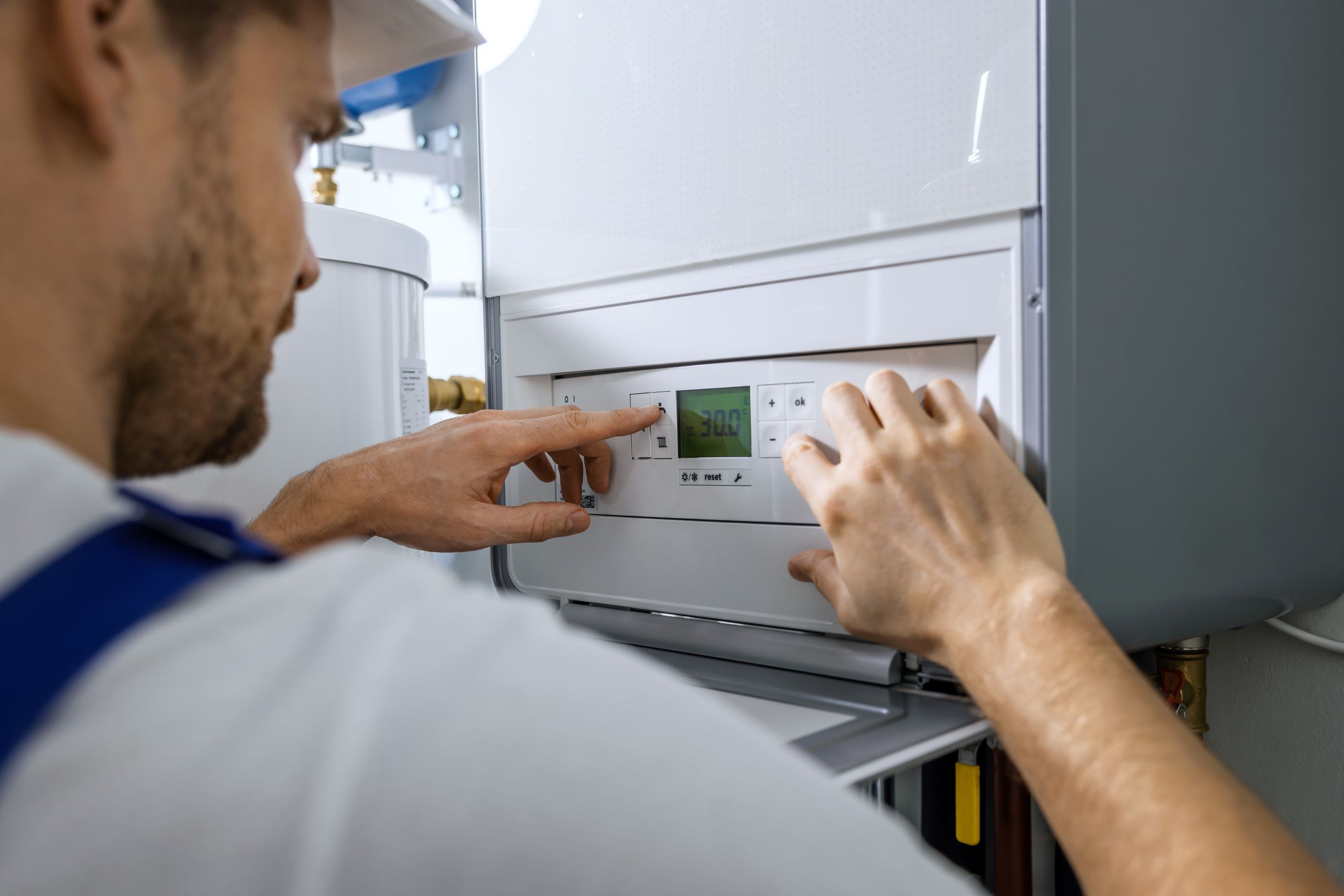 Man repairing boiler