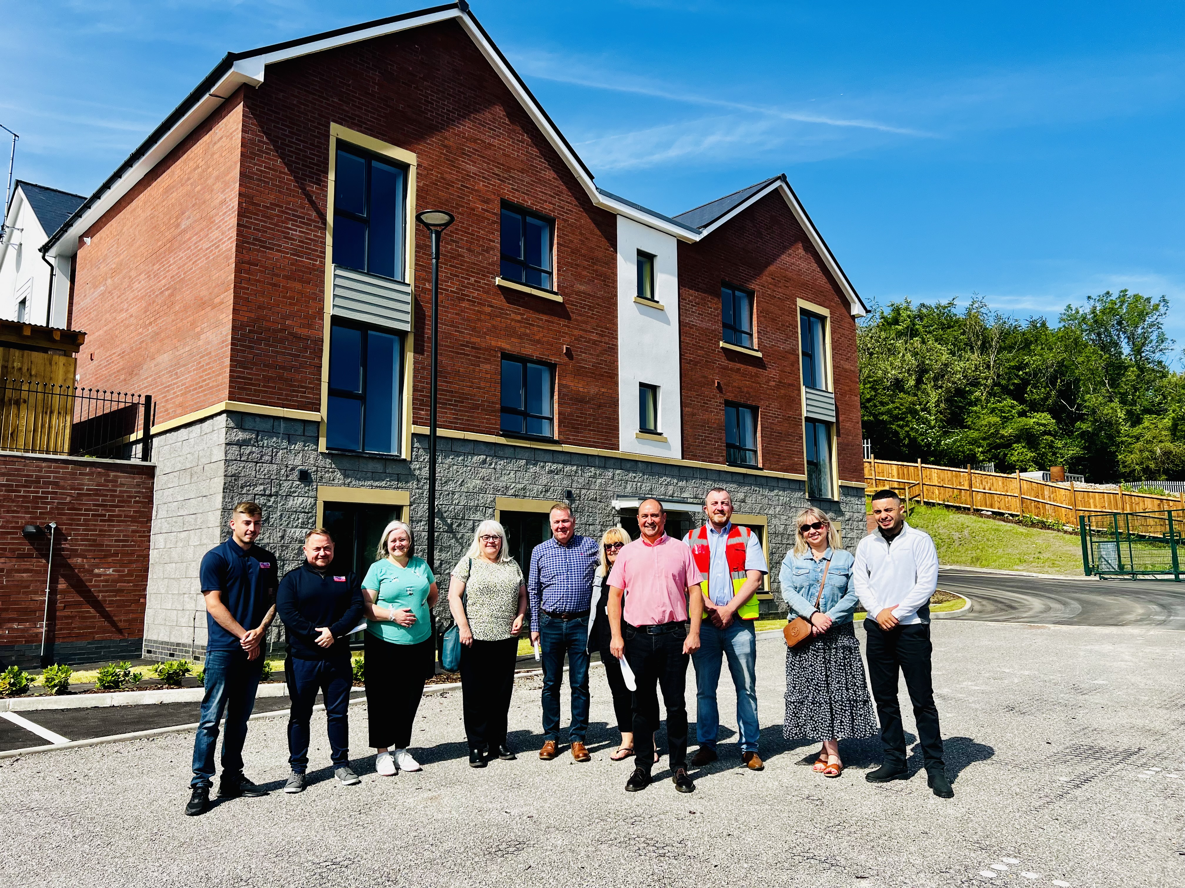 People in front of a block of flats