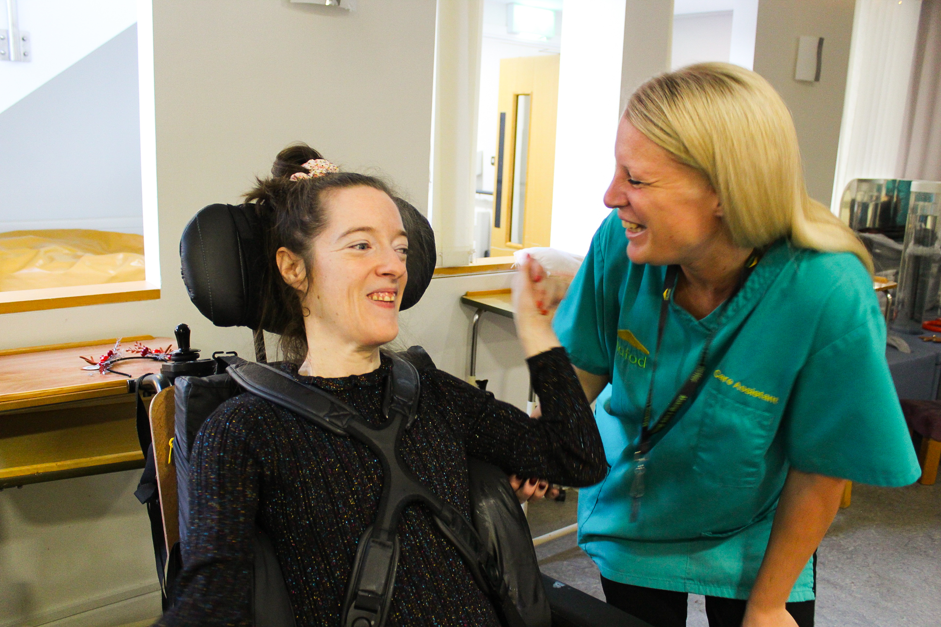 Resident and carer on APD unit at Tŷ Penrhos Care Home