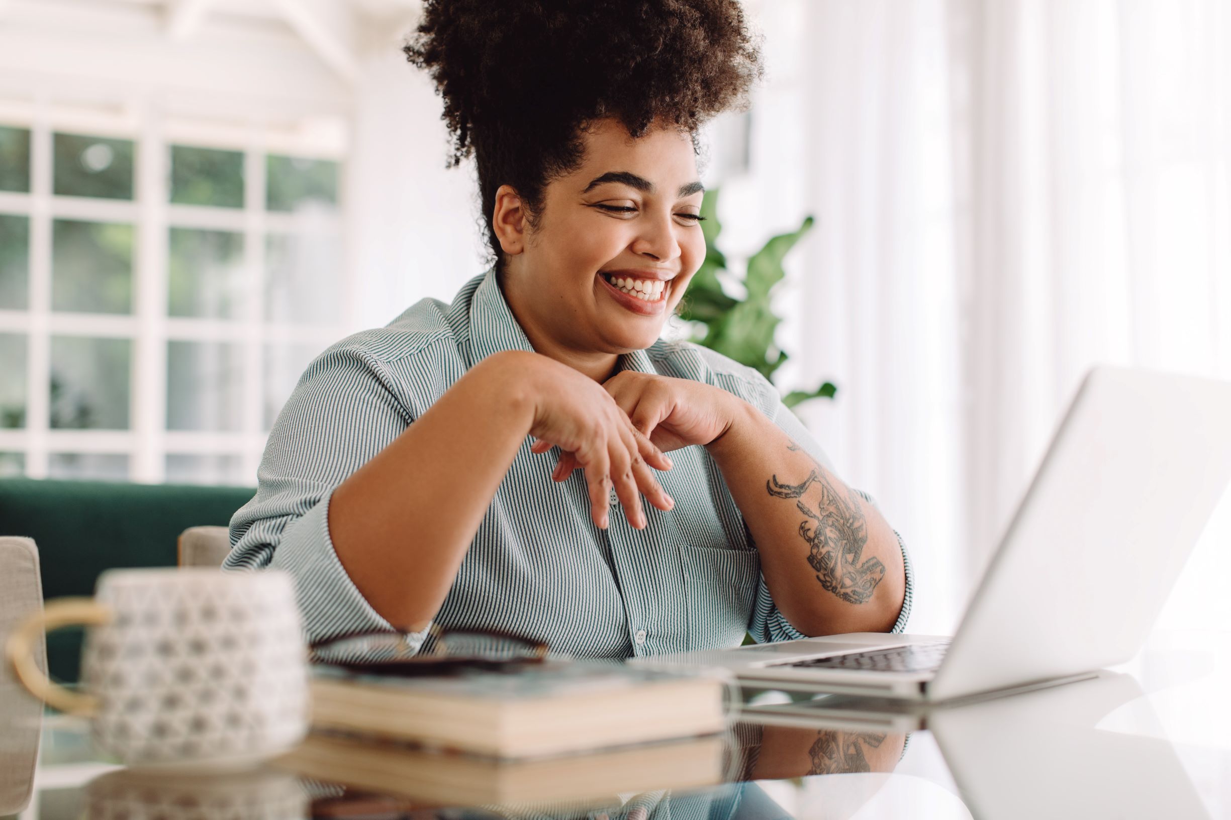 Woman using her laptop at the table