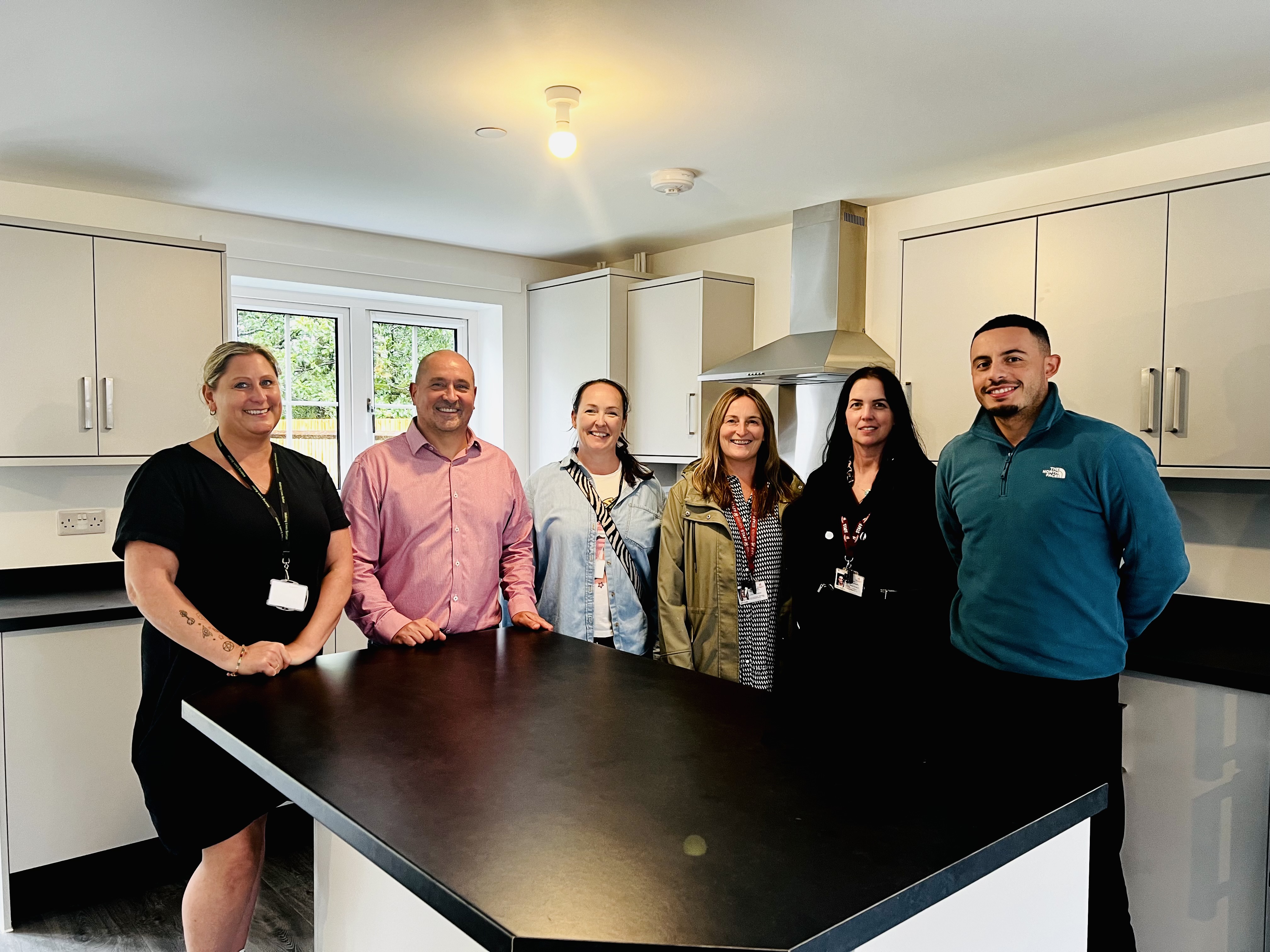 A group of people in a kitchen