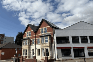 Red brick building with bay windows
