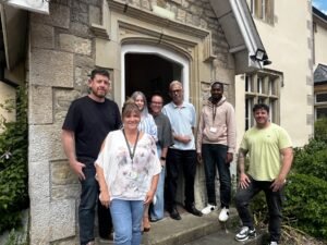 Hafod Housing Association Bridgend Hub team standing infront of a building