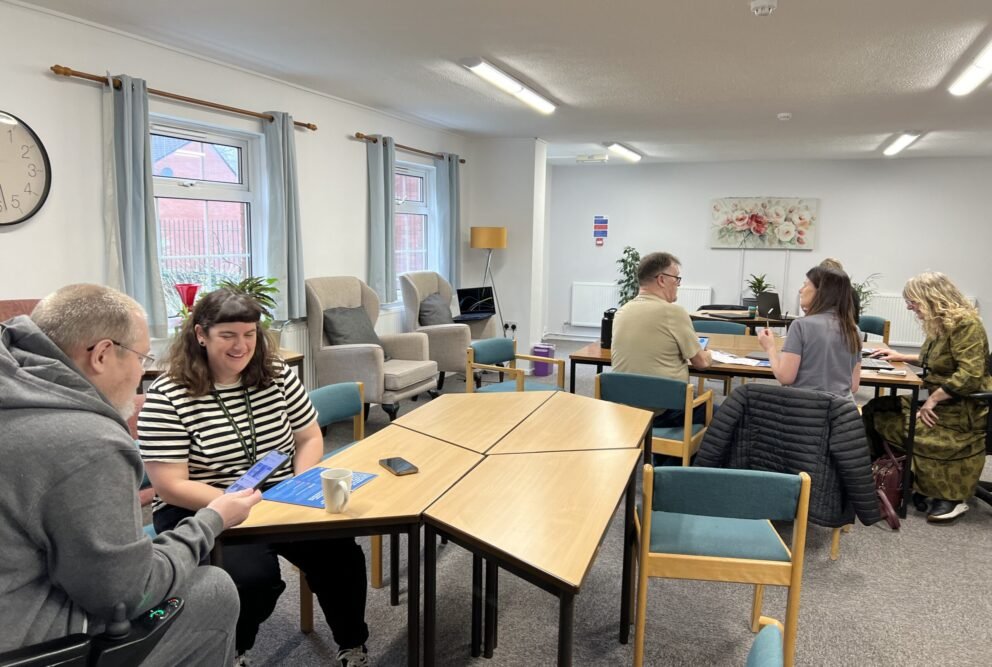 Hafod Housing Association footprint decarbonisation community engagement day customers and colleagues getting help with smart apps