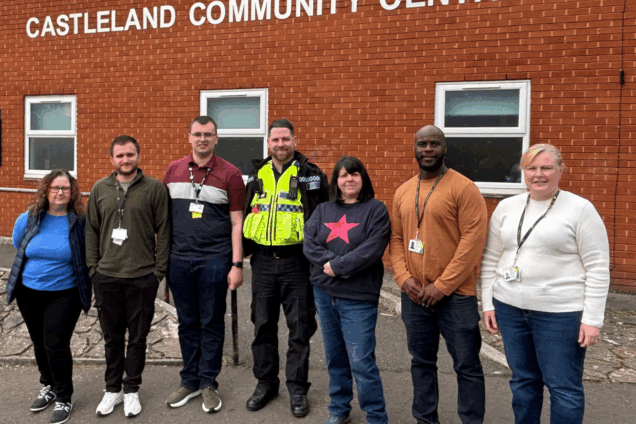Hafod Housing Association neighbourhood coaches with a PSCO infront of a community centre