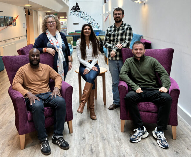 Vale hub neighbourhood coaches sitting down in Golau Caredig