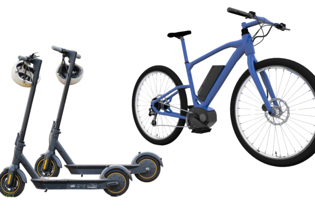 A photo showing two black escooters with helmets and a blue ebike