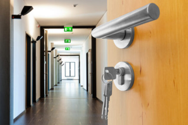 keys in fire door looking down a corridor