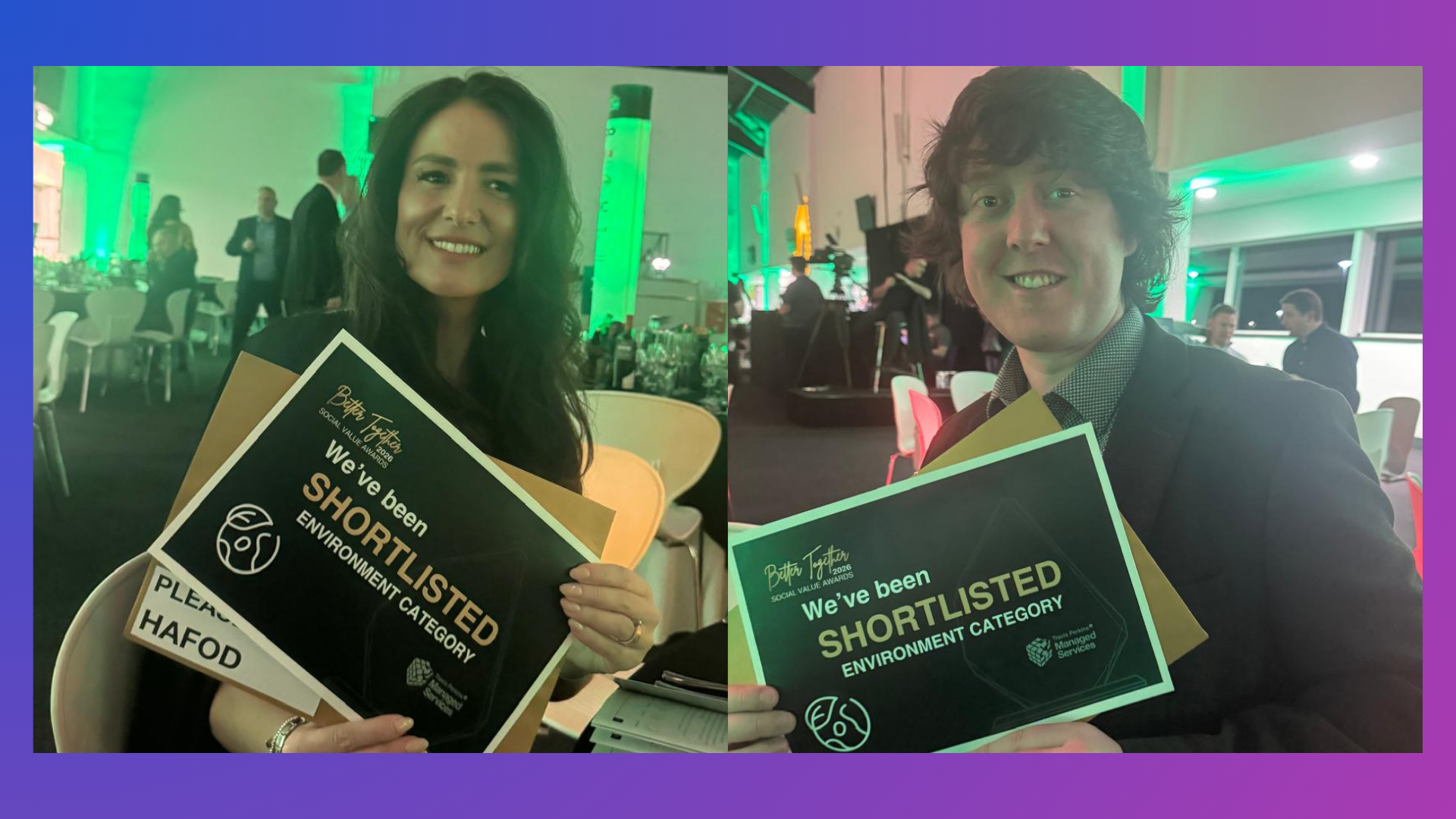 Two people seated indoors at an event venue, each holding a sign that reads “We’ve been shortlisted – Environment Category” for the Travis Perkins Better Together Awards. The background shows tables, chairs, and green event lighting.