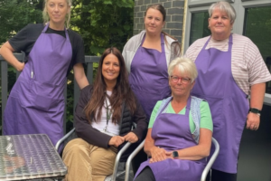 Fir Tree Food Pantry volunteers sitting outside the centre