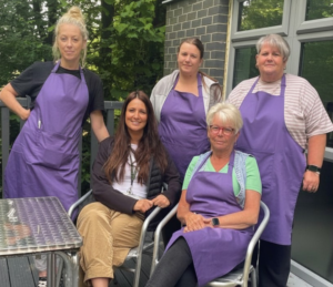 Fir Tree Food Pantry volunteers sitting outside the centre