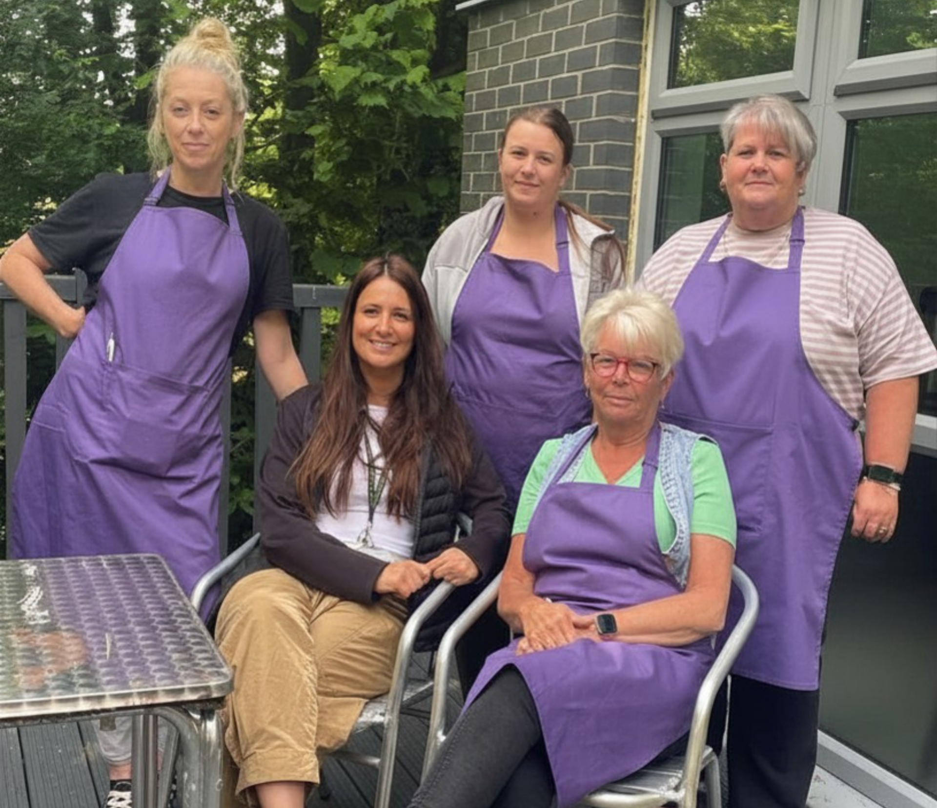 Fir Tree Food Pantry volunteers sitting outside the centre