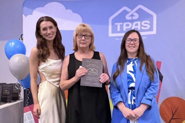 Tenant Claire Ryan with TPAS Cymru Tenant of the Year award