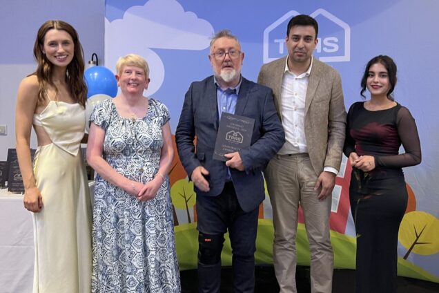 Our Scrutiny Panel and Board memeber recieving their TPAS Cymru award