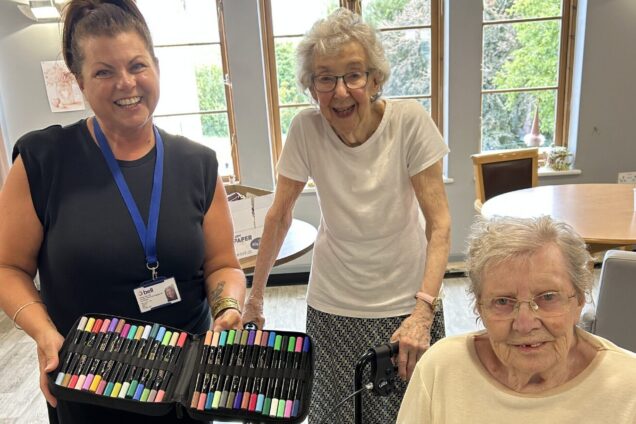 Care home residents smile alongside Bell's social value manager