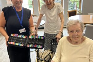 Care home residents smile alongside Bell Group's social value manager