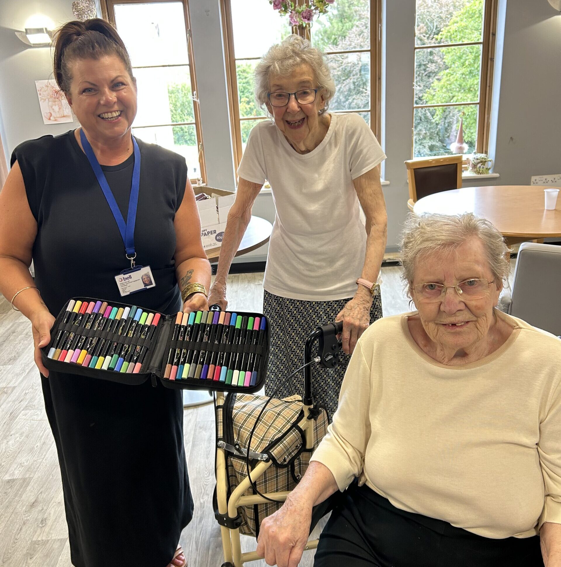 Care home residents smile alongside Bell Group's social value manager