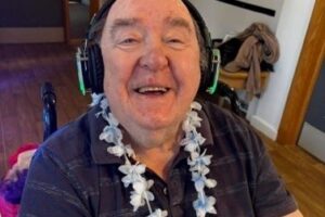 Resident smiling and wearing headphones as part of silent disco